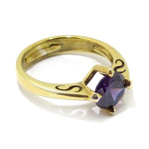 Anillo circonita morada de plata dorada